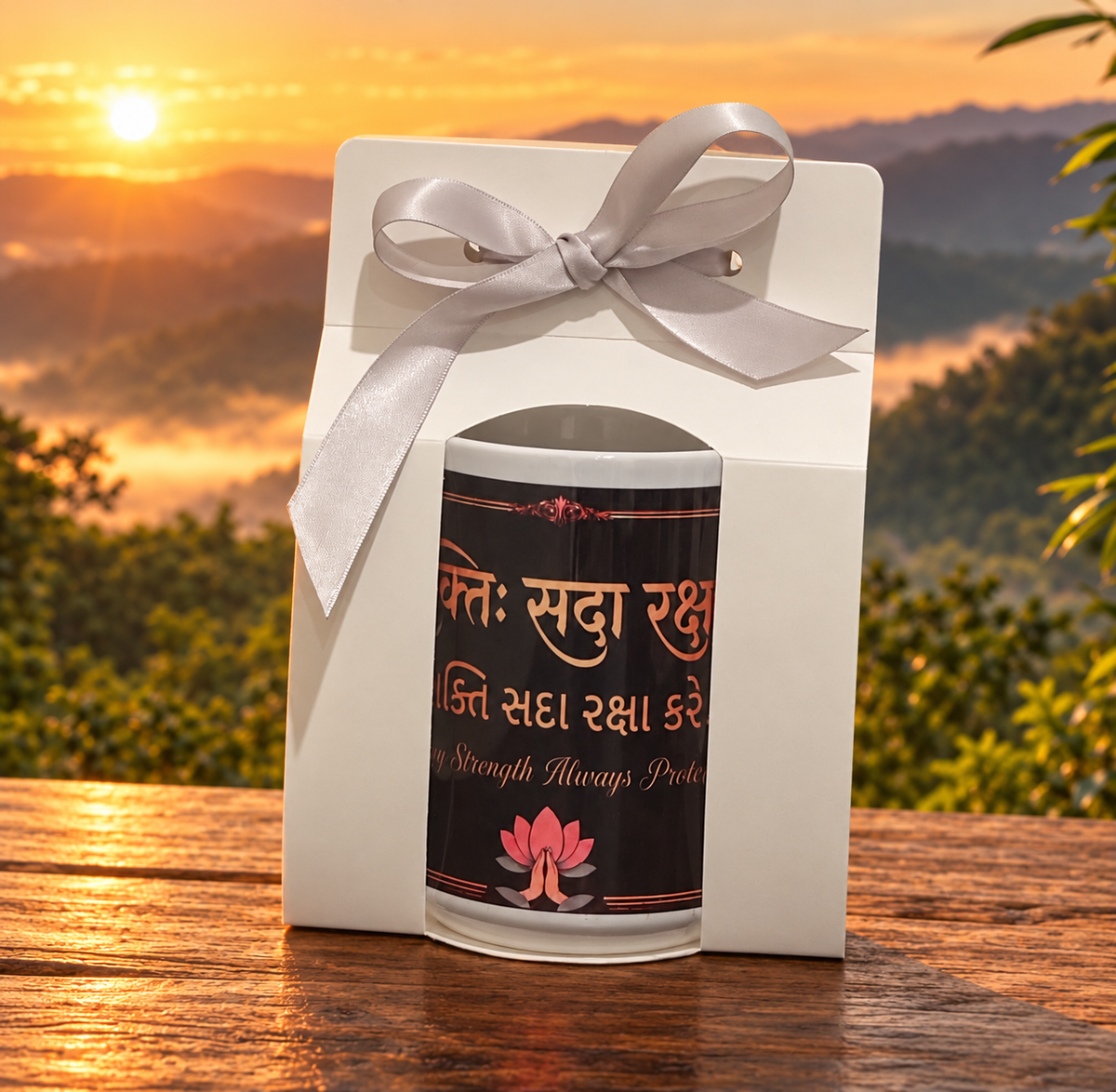 Front view of Shakti Navratri mug in gift-ready white packaging with ribbon.

Packaged mug side